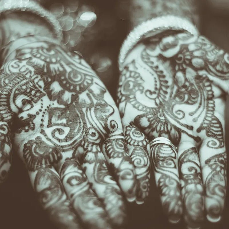 Henna tattooed hands.