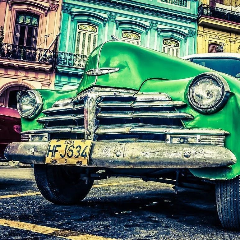 Green car parked in Havana.