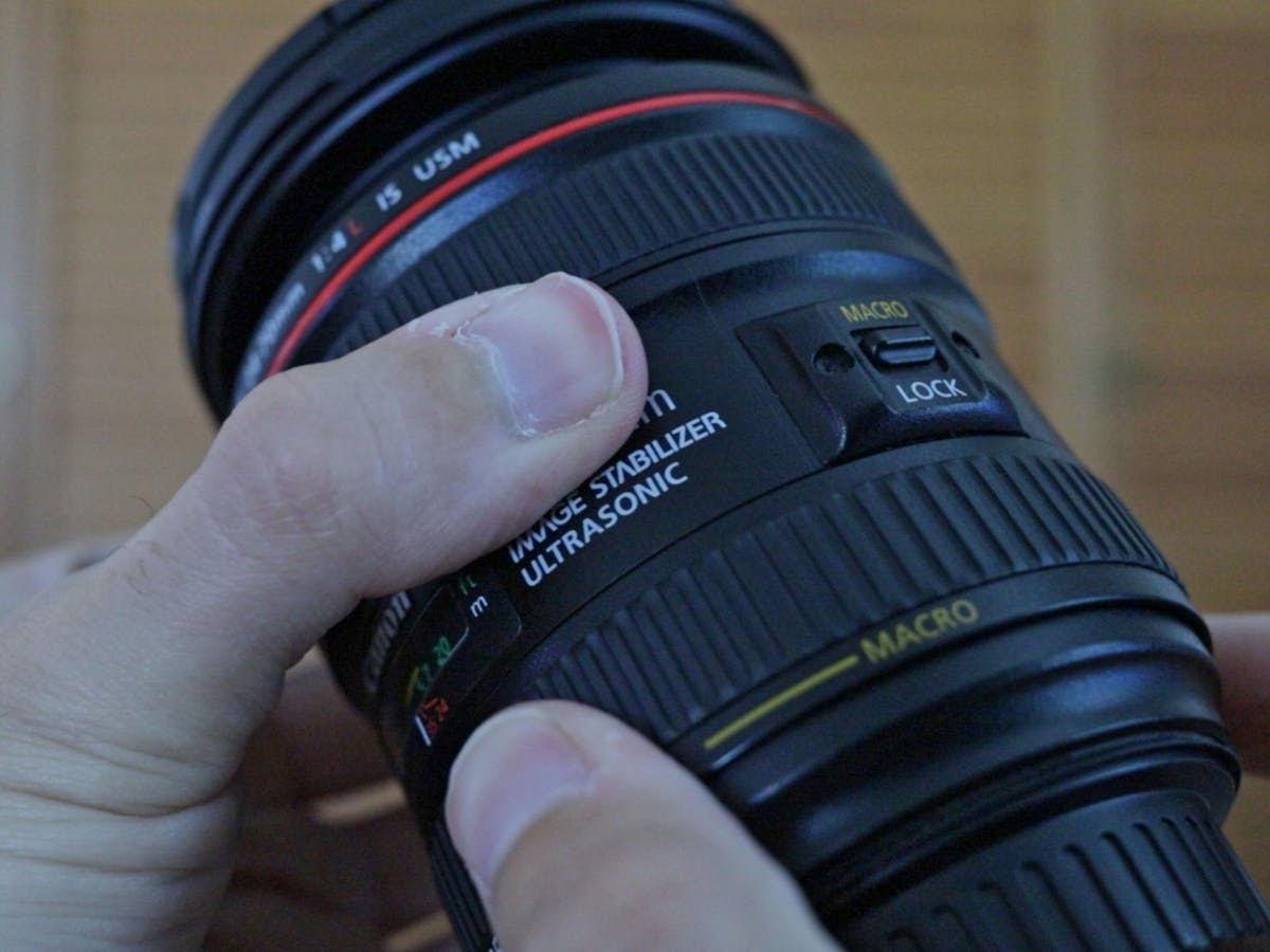 Canon EF 24-70mm f4L ISM focus ring in my hands.