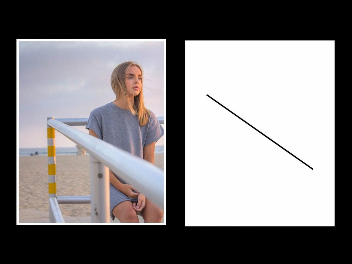 Diagonal leading lines with a girl sitting on a rail.