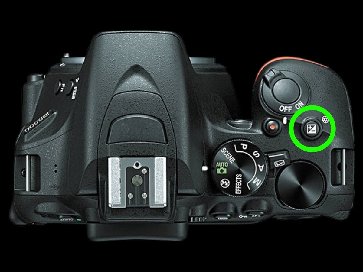 Nikon camera showing the exposure compensation button.