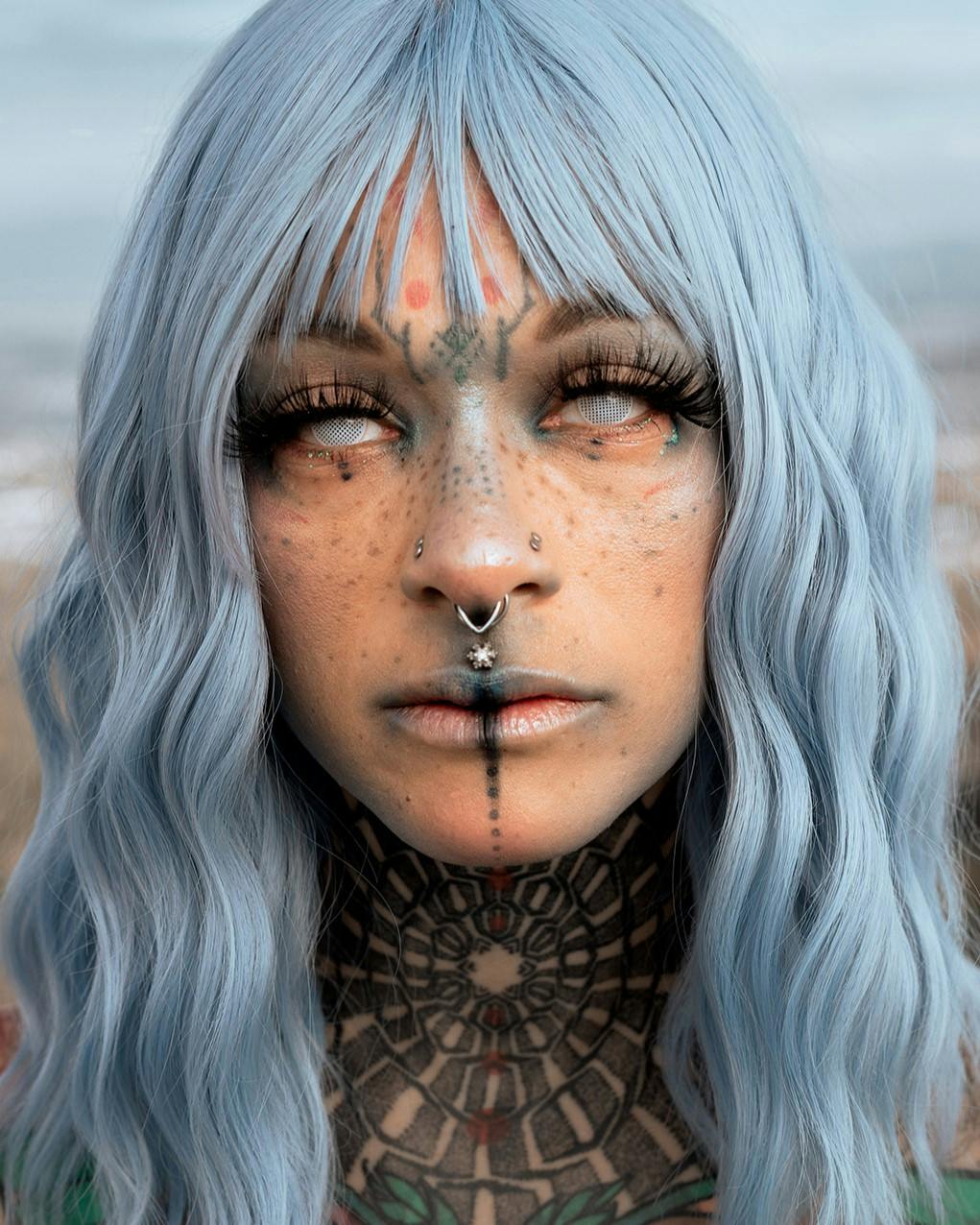 Girl with face tattoos and white hair for a headshot photo.