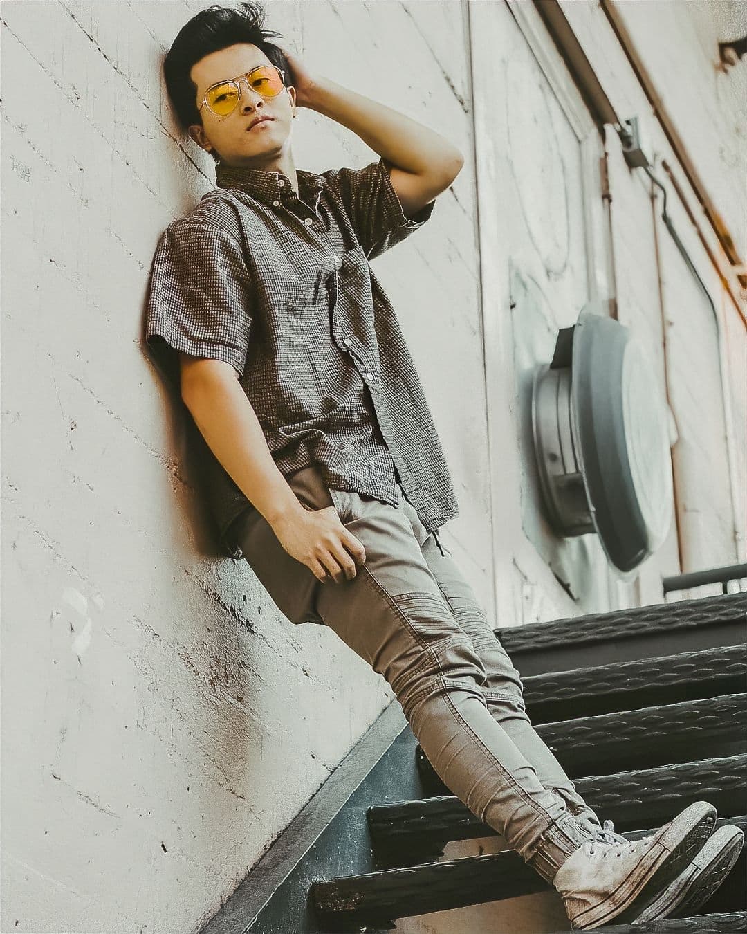 Example full-body portrait of man standing on stairs.