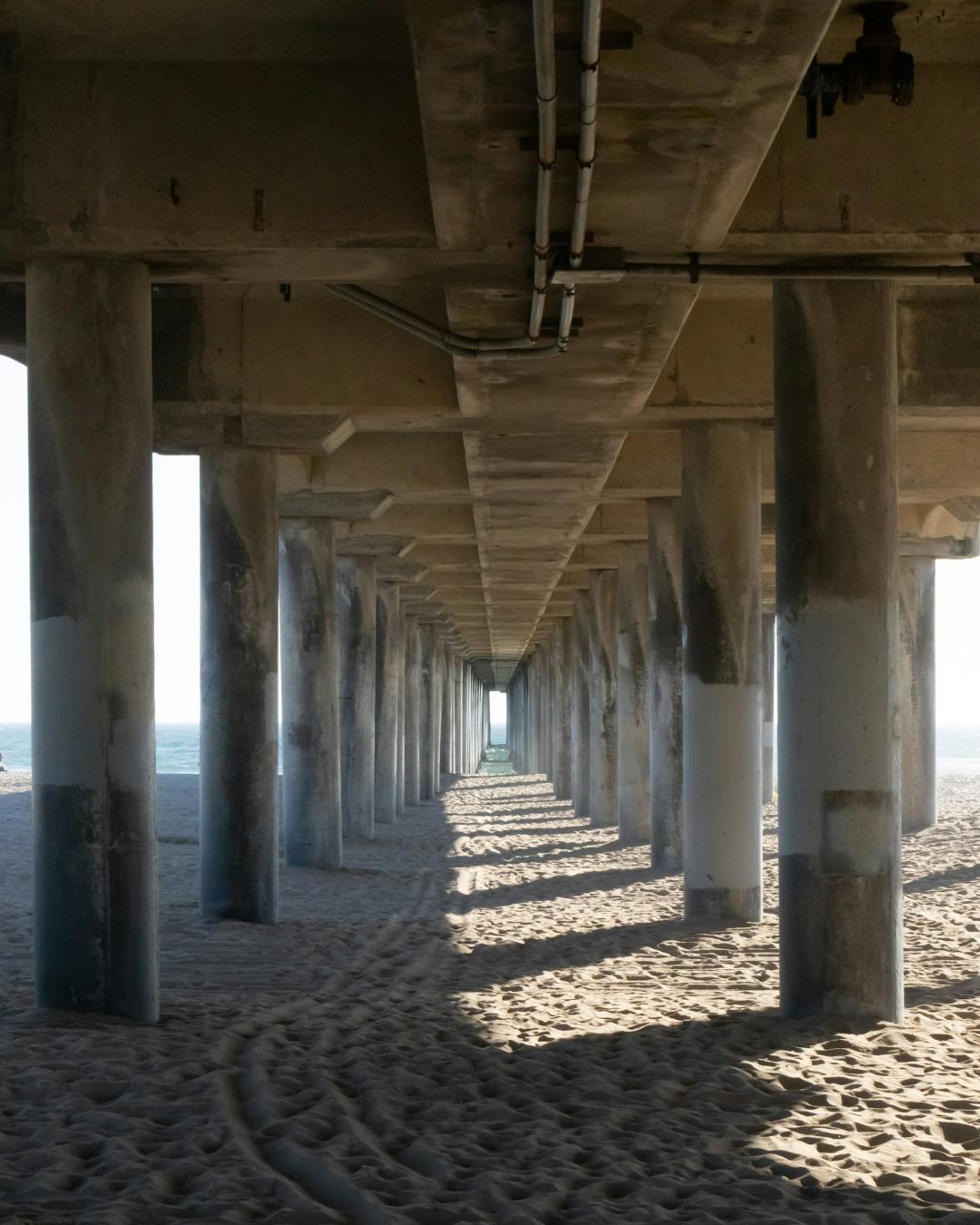 Underneath the pier leading line.