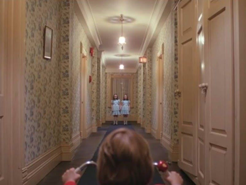 Scene from The Shining with leading lines of the hallways.