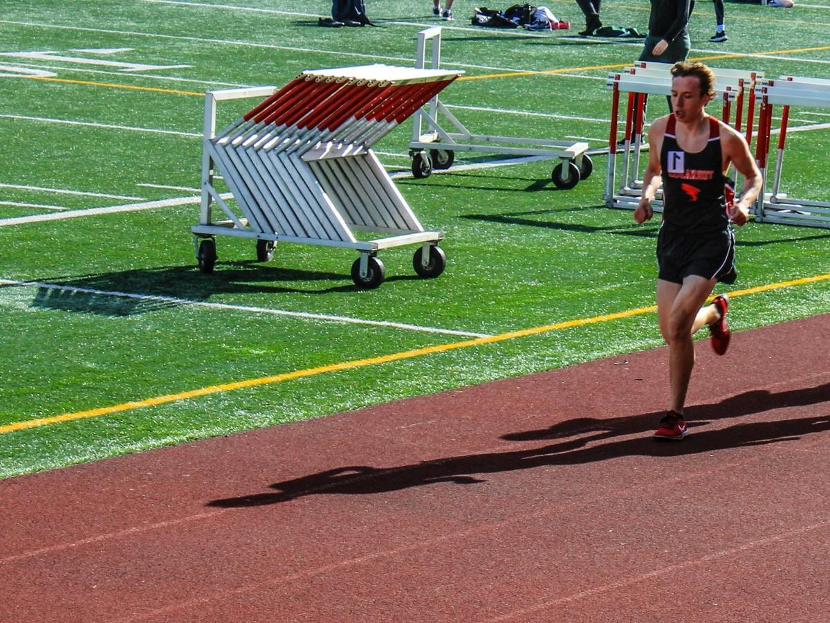 Man running a race from a high vantage point.