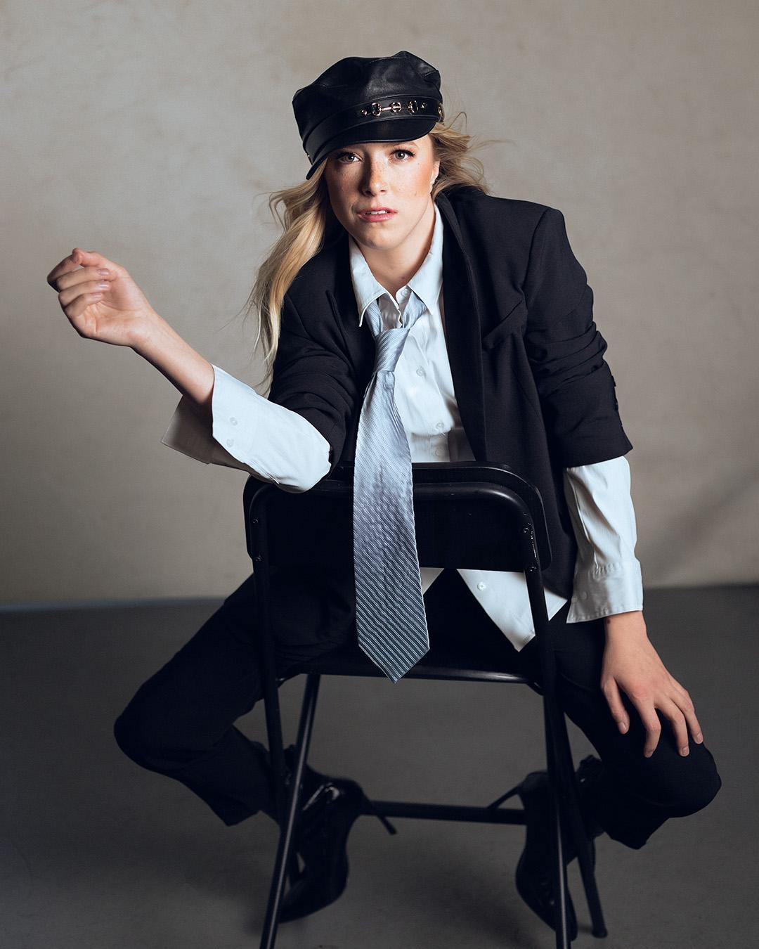 Woman sitting on a chair backwards.