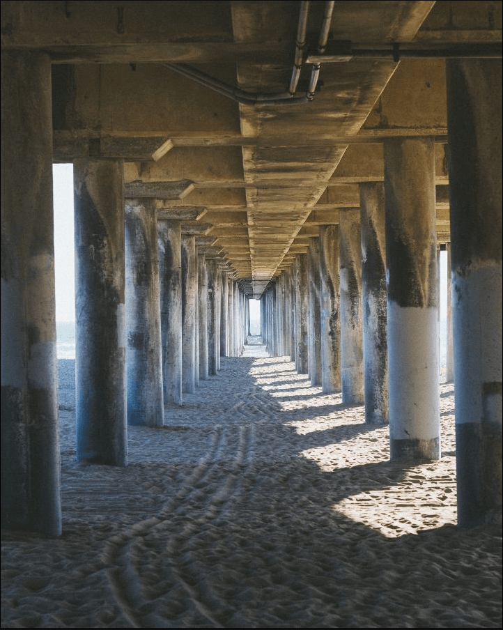 50mm on crop sensor = 75mm Photo underneath pier taken with 50mm lens.