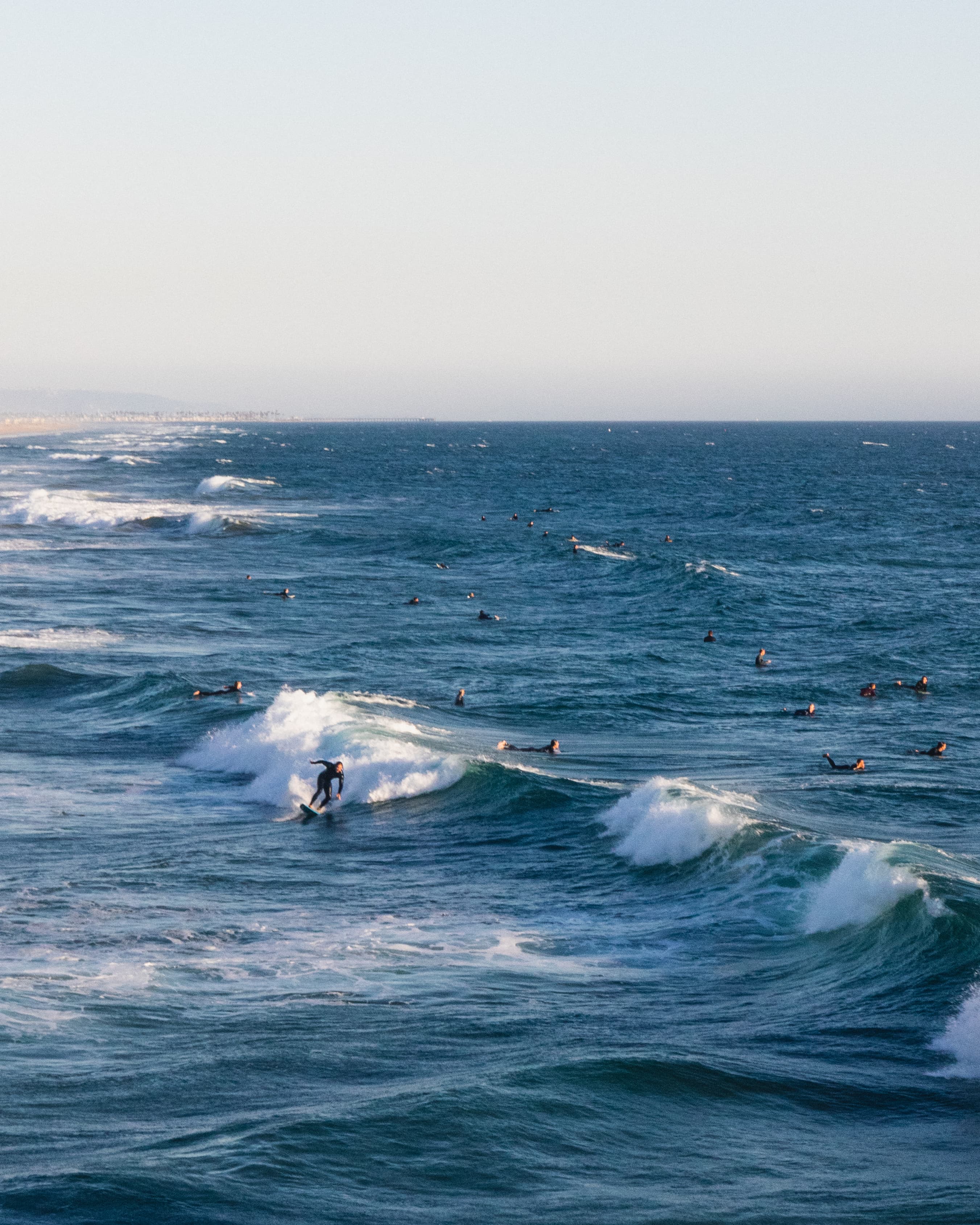 Canon EF 24-70mm f4L IS beach photo Canon EF 24-70mm f4L IS beach photo of surfers in the water.
