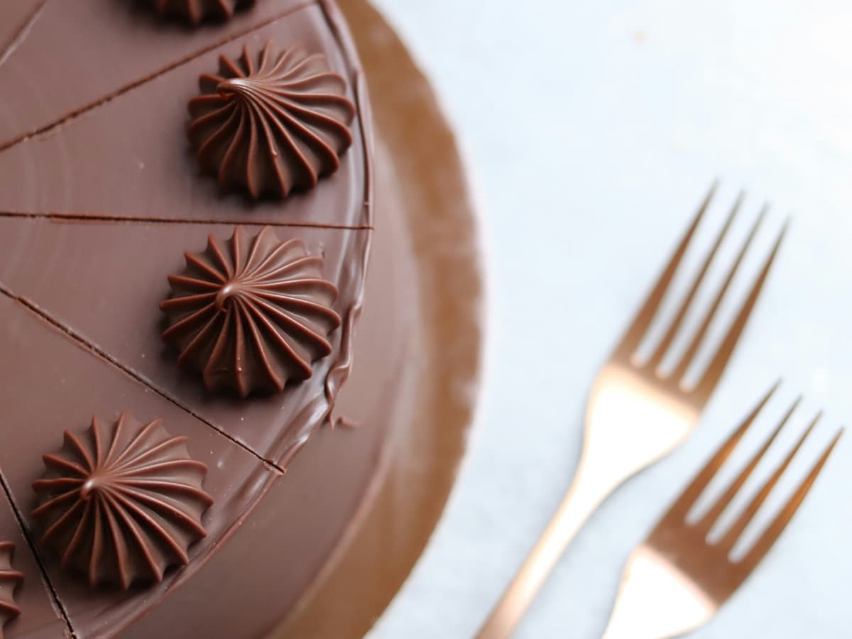 Food photography example Chocolate cake on white table.