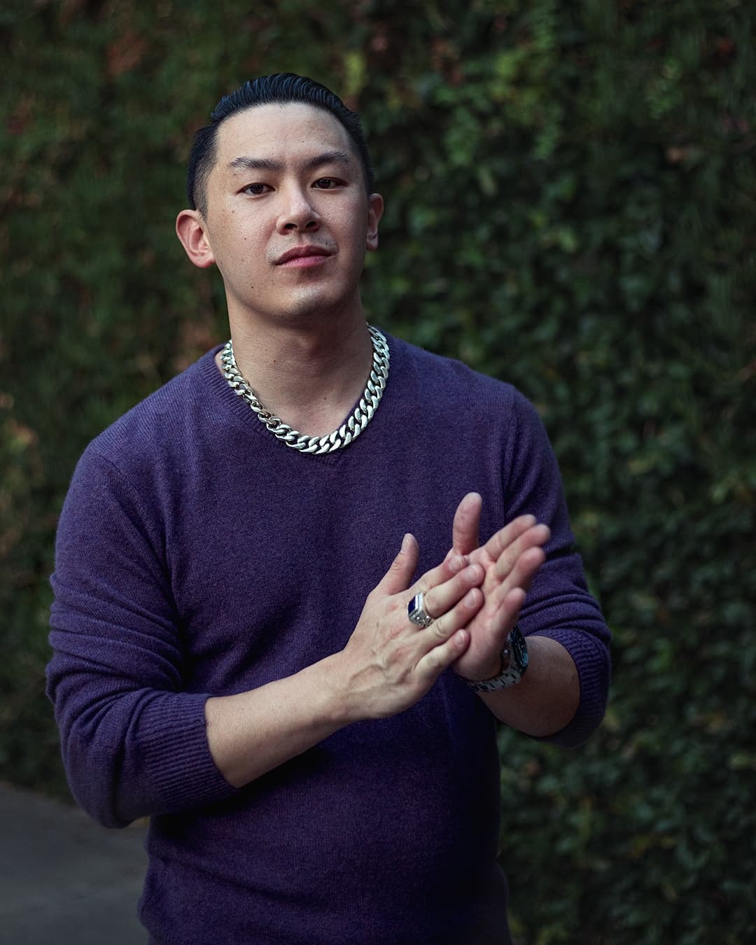 Hand rub male pose Man posing in purple sweather rubbing his hands.