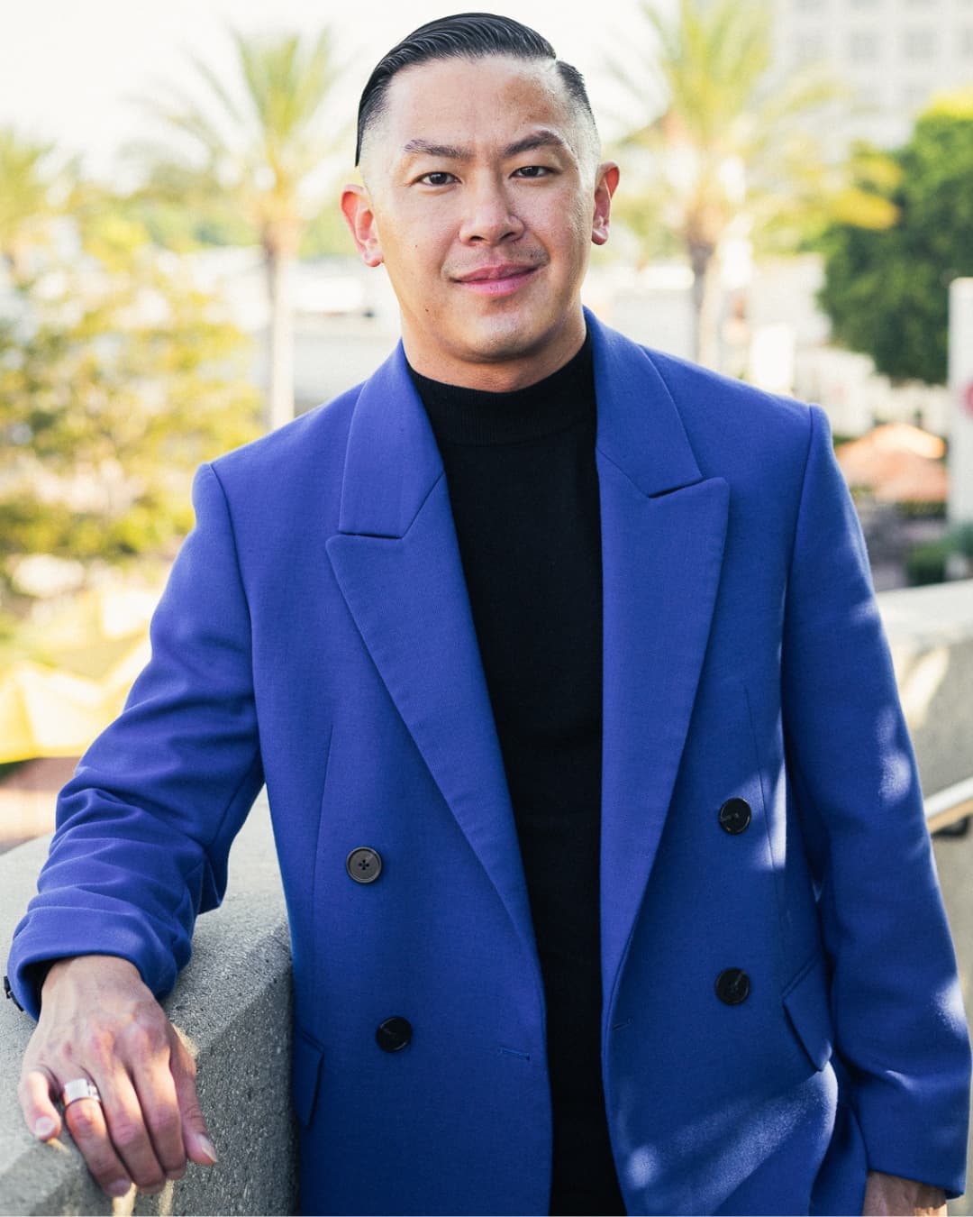 Leaning on arm rest male pose Man posing in blue suit leaning his arm on an arm rest.